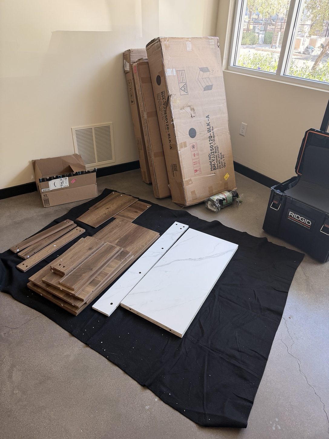 Furniture pieces arranged on a protected work surface